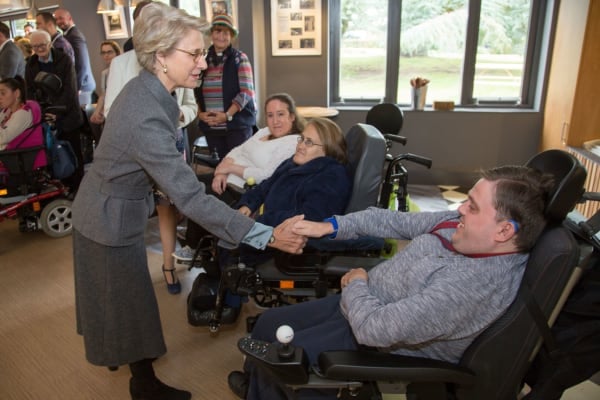 HRH Duchess of Gloucester shaking hands with resident 